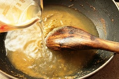 Add in the chicken broth, stir to mix well
