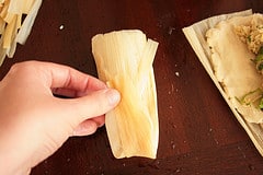 Fold up the skinny bottom part of the husk