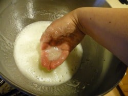 Over a saucepan of simmering water, warm the egg white mixture