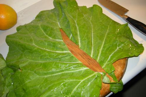 Wash 4 collard leaves, cut out the stem, and cut in half
