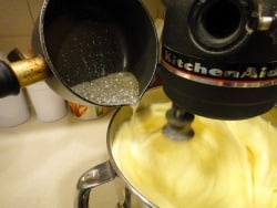 drizzle the sugar syrup into the fluffy eggs