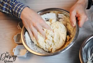 Knead the dough until it comes together