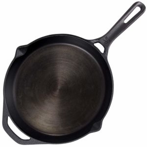The GreaterGoods Cast Iron Skillet 10 Inch is pictured over a field of white 