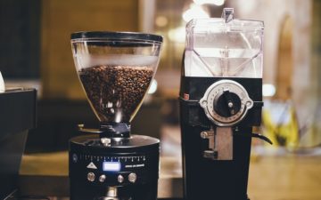 A pair of coffee grinders are pictured in a coffee shop