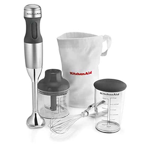 The KitchenAid KHB2351CU 3-Speed Hand Blender is pictured alongside its included accessories 