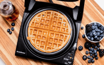 Waffle Maker with Blueberries and Syrup to the Side