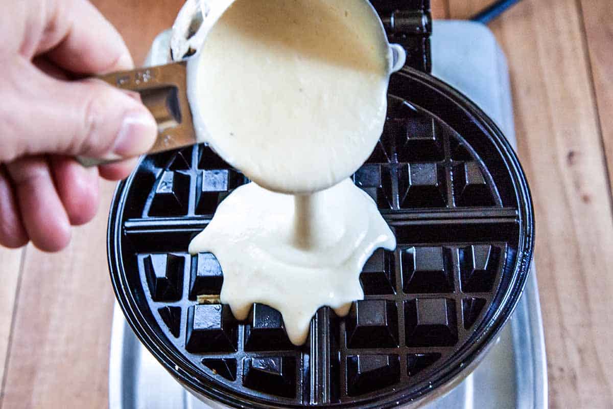 Pouring the waffle batter in the waffle maker