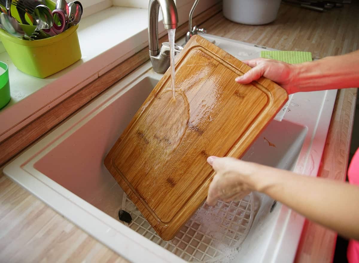 How do you clean a wooden chopping board