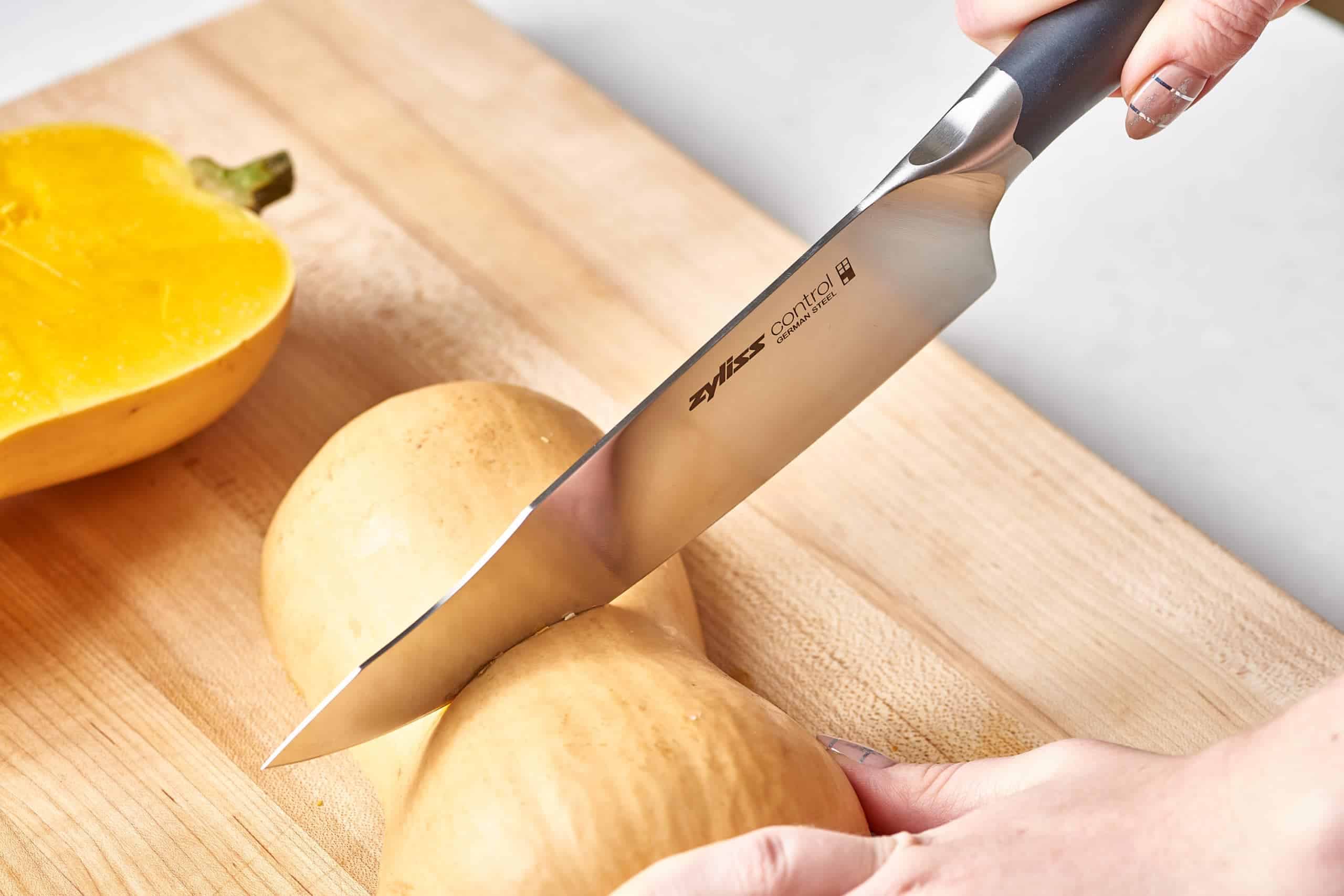 Chef Knife Cutting Through Squash Scaled 