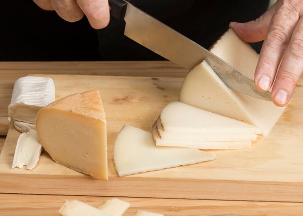 Shredding cheese with a knife