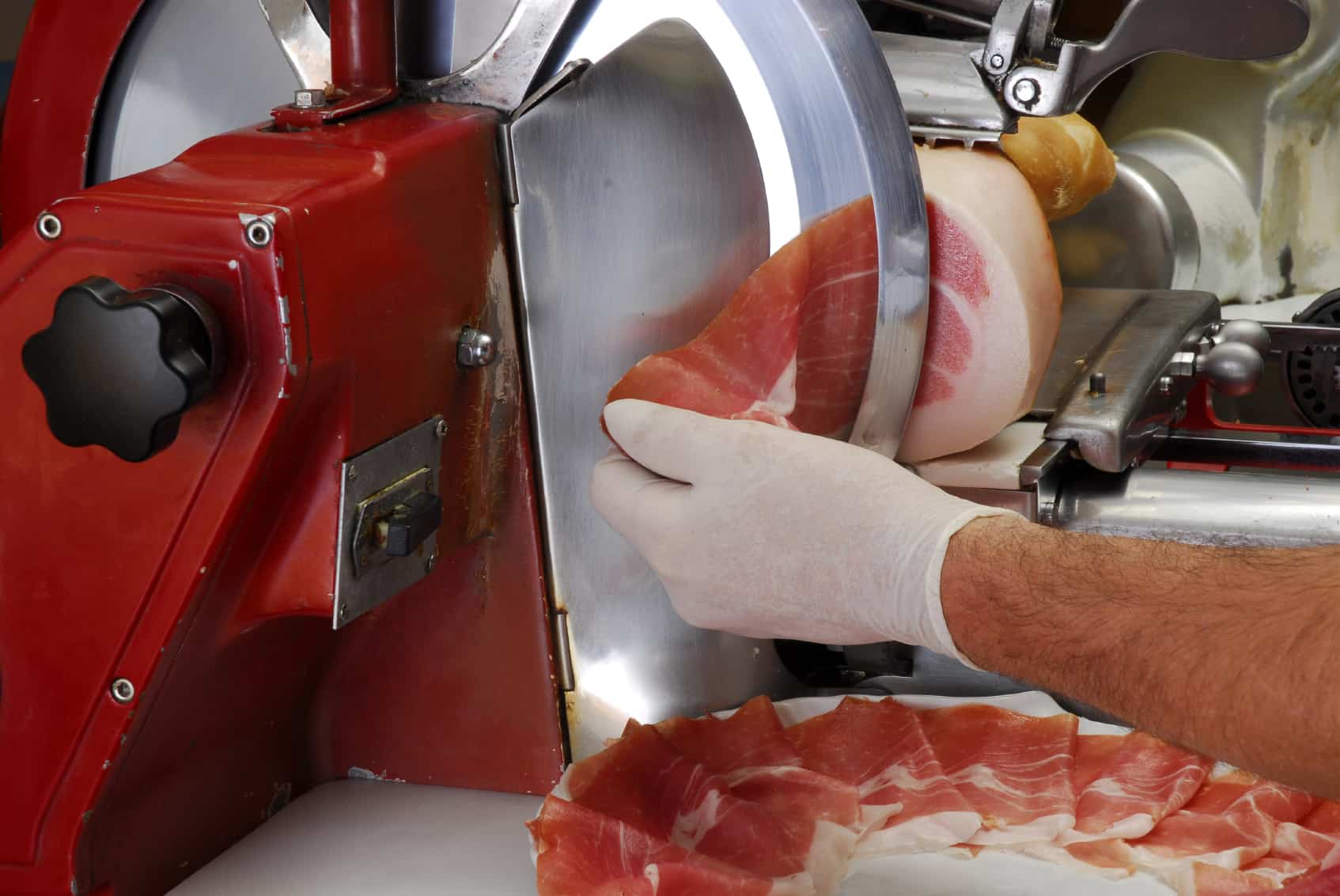 Slicing meat with a meat slicer