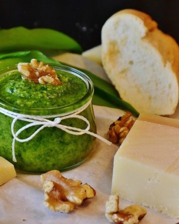 Pesto next to bread and cheese