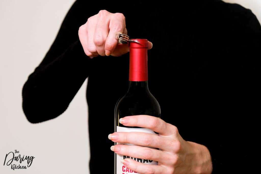 how to open a wine bottle with a key