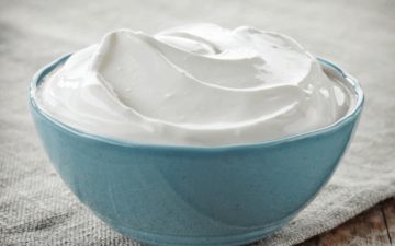 sour cream in a blue bowl ready to be frozen.