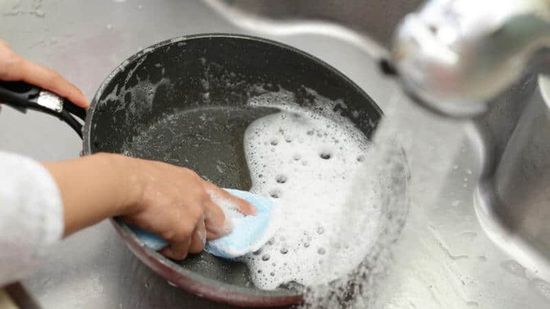 Cleaning ceramic cookware with soapy water